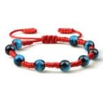 Pulsera Shamballa roja y azul con piedra ojo de halcón negra